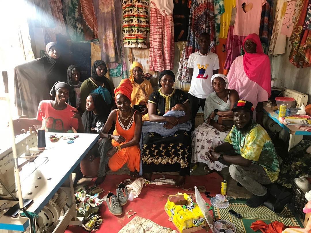 Students, families, and community members gathered during a Kunning Gambia and Great Minds Skills Training Centre event in June 2026.